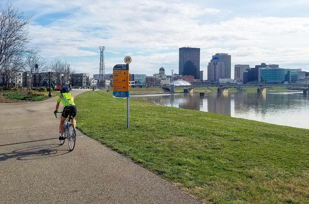 Montgomery County Bike Path trail alongside river with downtown Dayton in view
